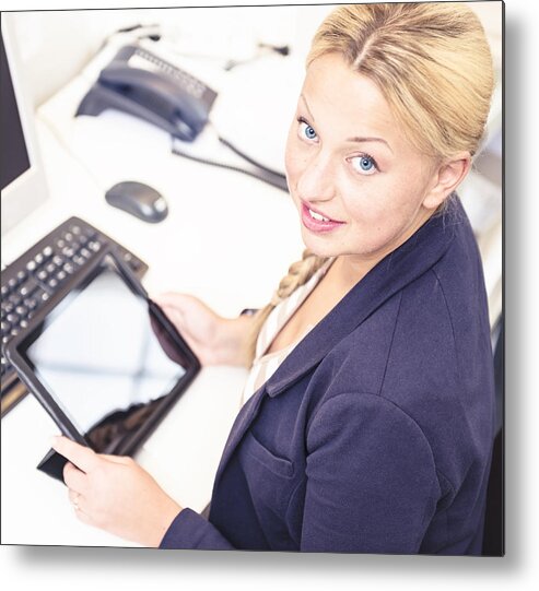 Working Metal Print featuring the photograph Secretary in her office using a digital tablet by Franckreporter