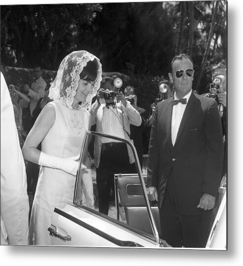 Easter Metal Print featuring the photograph Jackie Kennedy Enters A Car As She by Bert Morgan