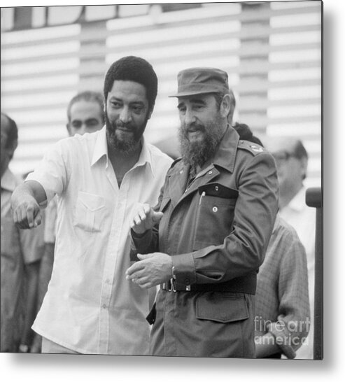 1980-1989 Metal Print featuring the photograph Maurice Bishop With Fidel Castro by Bettmann