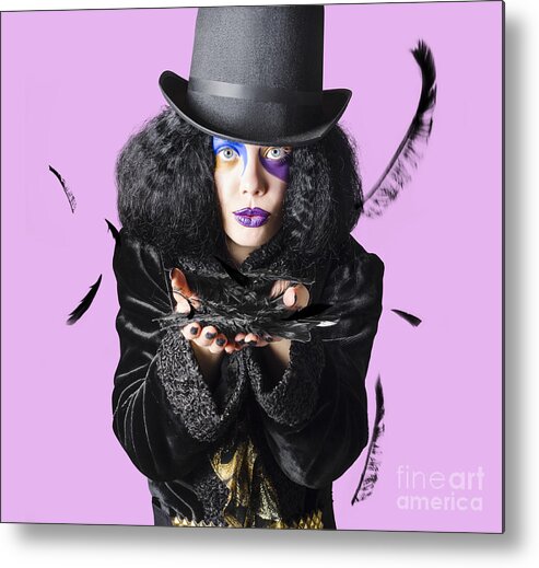 Magician Metal Print featuring the photograph Magician blowing feathers by Jorgo Photography