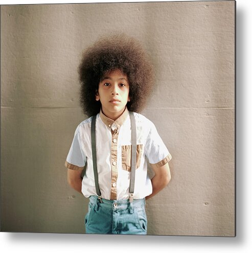 Child Metal Print featuring the photograph Young Boy Standing In Front Of A Wall by Alys Tomlinson