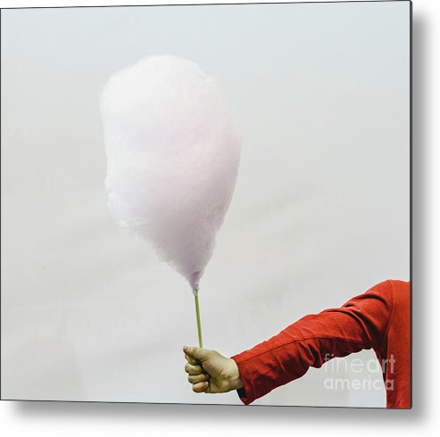 Attractive Metal Print featuring the photograph Cotton Candy Held By The Hand Of A Child, Isolated On White Background. by Joaquin Corbalan