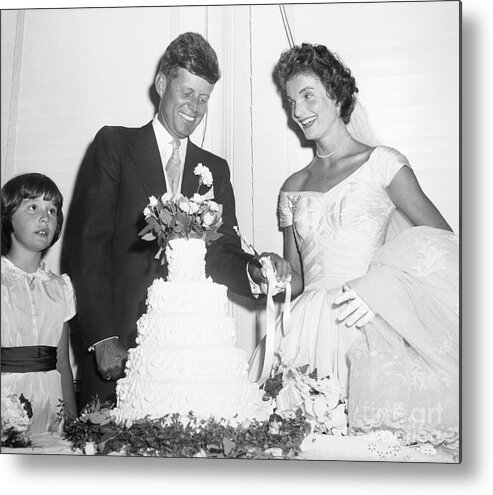 Bridegroom Metal Print featuring the photograph John And Jacqueline Kennedy Cut Wedding by Bettmann