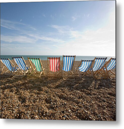 Tranquility Metal Print featuring the photograph Rental Loungers On Beach, Rear View by Grant V. Faint