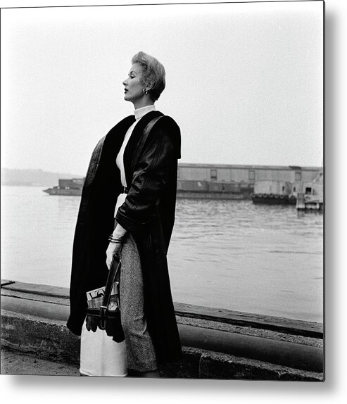One Person Metal Print featuring the photograph A Model Standing On A Dock In A Leather Coat #1 by Richard Rutledge