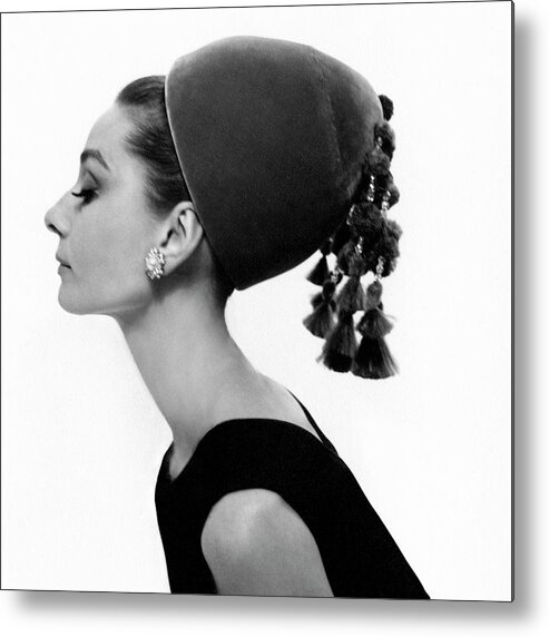 Accessories Beauty Fashion Personality Actress Studio Shot One Person People Hat Headgear Side View Audrey Hepburn 1960s Style Givenchy Eyes Closed Head And Shoulders Oriental Velvet Tassel 35-39 Years Mid-adult 30s Adult Female Mid Adult Woman #condenastvoguephotograph August 15th 1964 Metal Print featuring the photograph Audrey Hepburn Wearing A Givenchy Hat by Cecil Beaton