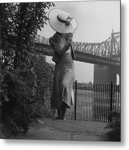 Accessories Metal Print featuring the photograph A Model In Front Of The 59th Street Bridge by Horst P Horst