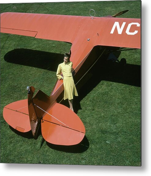 Accessories Metal Print featuring the photograph A Model Leaning On An Airplane by Toni Frissell