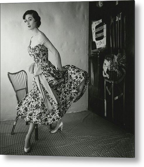 Fashion Metal Print featuring the photograph A Model Wearing A Floral Dress by Henry Clarke