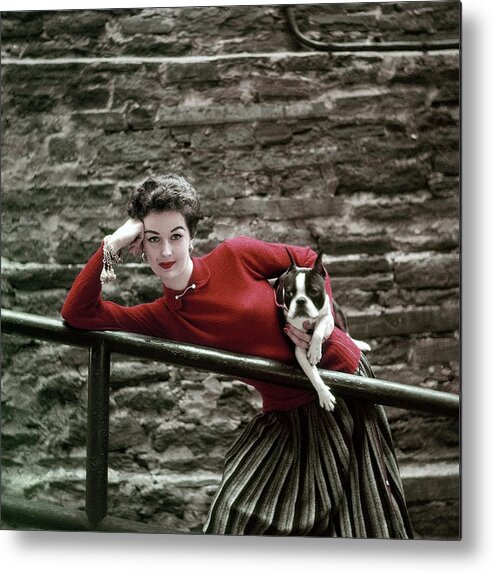 Animal Metal Print featuring the photograph A Model With A Dog Leaning On A Railing by Richard Rutledge