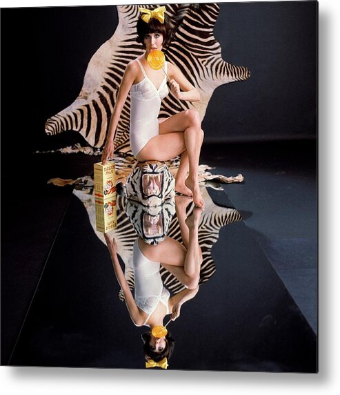 Fashion Metal Print featuring the photograph A Model With Animal Skins by John Rawlings
