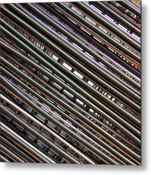 In A Row Metal Print featuring the photograph Abstract View Of Shopping Baskets by Andrea Kennard Photography