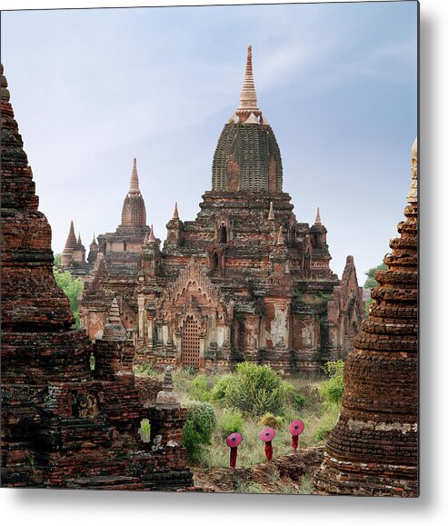 Tranquility Metal Print featuring the photograph Buddhist Monks Walking Past Temple by Martin Puddy