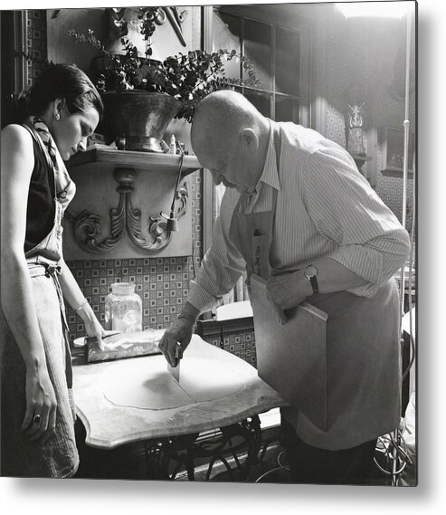Indoors Metal Print featuring the photograph James Beard Cutting Pastry by Ernst Beadle