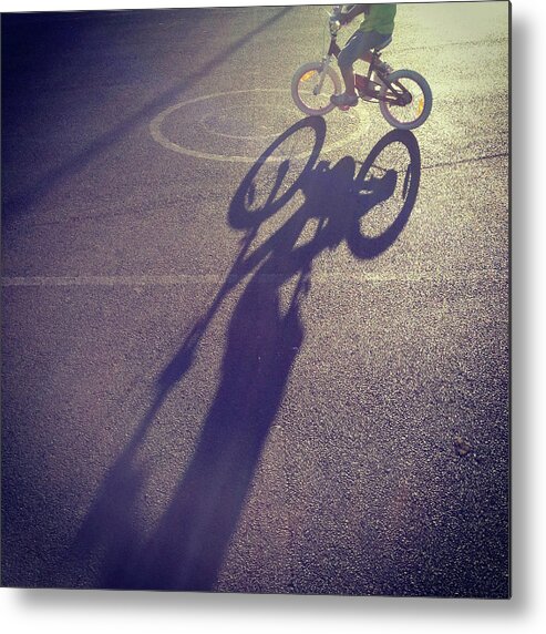 Shadow Metal Print featuring the photograph Long Shadow Of Child Riding A Bicycle by Jodie Griggs