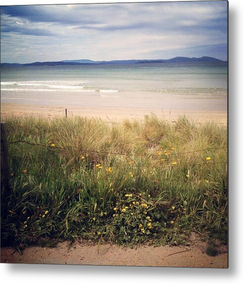 Water's Edge Metal Print featuring the photograph Looking Over Grass Towards Dark Clouds by Jodie Griggs