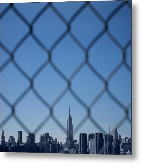 Tranquility Metal Print featuring the photograph Manhattan Skyline Through The Fence by Maciej Toporowicz, Nyc