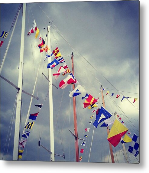 Pole Metal Print featuring the photograph Marine Signal Flags On Mast Against A by Jodie Griggs