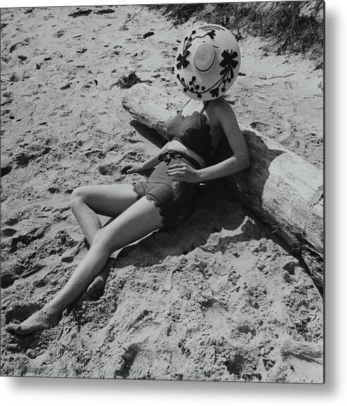 Accessories Metal Print featuring the photograph Model Covering Her Face With Hat On Beach by Toni Frissell