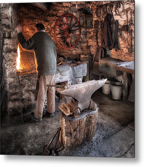 Blacksmith Metal Print featuring the photograph The Blacksmith 1 by Nigel R Bell