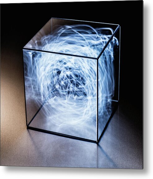 Confusion Metal Print featuring the photograph Trails Of Blue Light In Clear Box by Pm Images