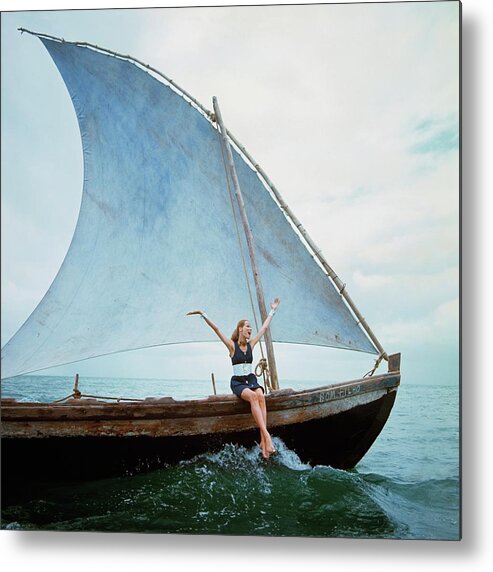 Boat Fashion Model Personality Veruschka Von Lehndorff German European Fashion Model Clothing One Person People Daytime Outdoors Arms Raised Happiness 25-29 Years Young Adult 20s Adult Female Young Woman Young Adult Woman Transportation Sailboat Water Sailing Leisure Recreation Sports Mouth Open Hair Tied Back Barefoot Dress Denim Ocean Sea Sky Belt Itaparica Island Brazil South America Latin America Bracelet Jewelry Sitting #condenastvoguephotograph January 15th 1968 Metal Print featuring the photograph Veruschka Von Lehndorff Sitting On Edge by Franco Rubartelli