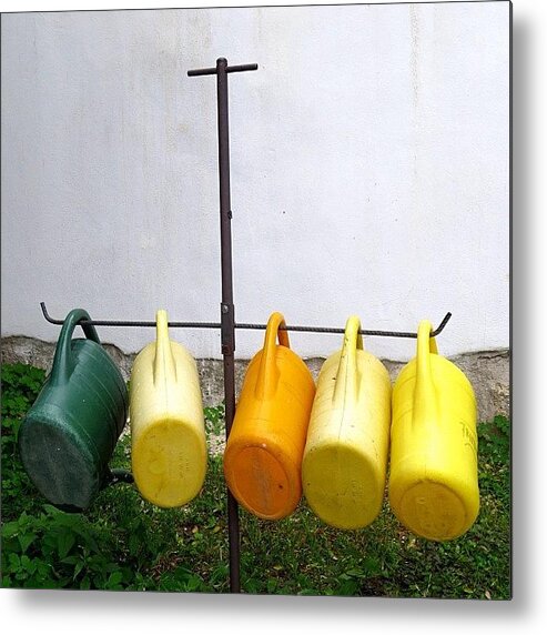  Metal Print featuring the photograph Watering Cans In A Village Cemetery In by Gia Marie Houck