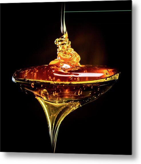 Brown Metal Print featuring the photograph Abstract of Honey Pouring Into Spoon by Kelly VanDellen
