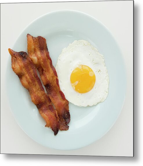 Unhealthy Eating Metal Print featuring the photograph Close Up Of Fried Egg With Bacon by Jamie Grill