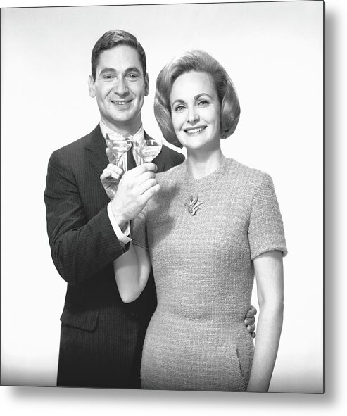 Heterosexual Couple Metal Print featuring the photograph Couple Toasting Champagne In Studio by George Marks