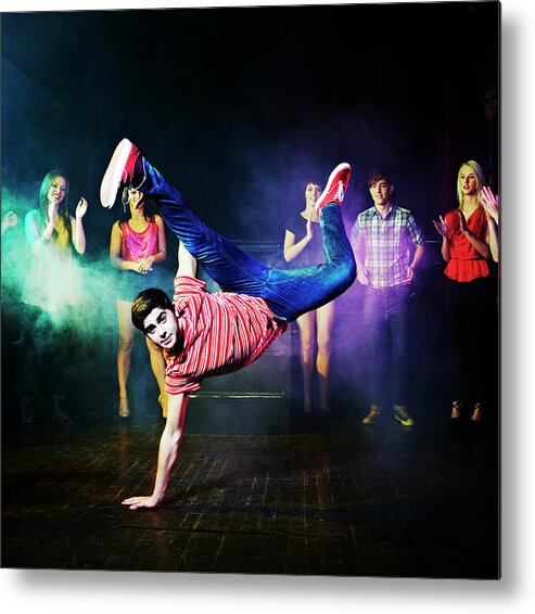 Young Men Metal Print featuring the photograph Man Dancing In Front Of A Crowd Of by Flashpop