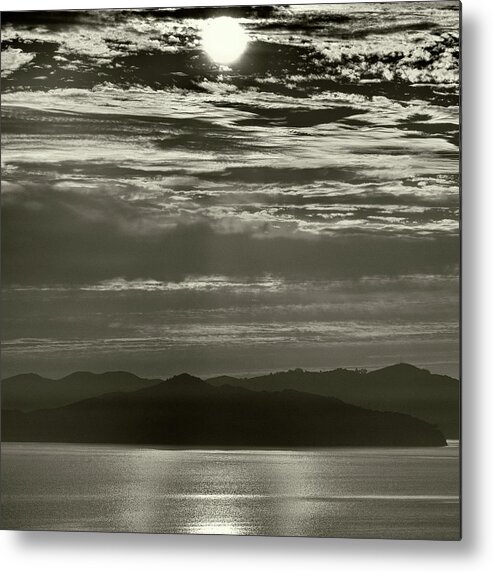 Mountain And Water With Sky And Eclipsed Sun Metal Print featuring the photograph Solar Wind by Geoffrey Ansel Agrons