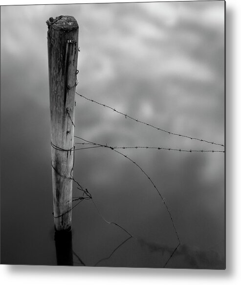 Wooden Post Metal Print featuring the photograph Wooden Post With Barbed Wire by Peter Levi