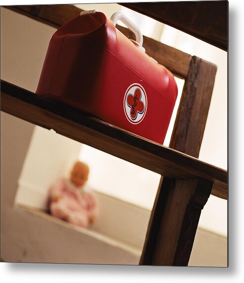 First Aid Kit Metal Print featuring the photograph Child's medical bag on chair. by Christian Zachariasen