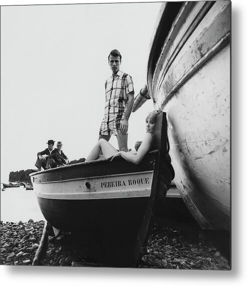 Fashion Metal Print featuring the photograph Couple in a Boat by Leonard Nones