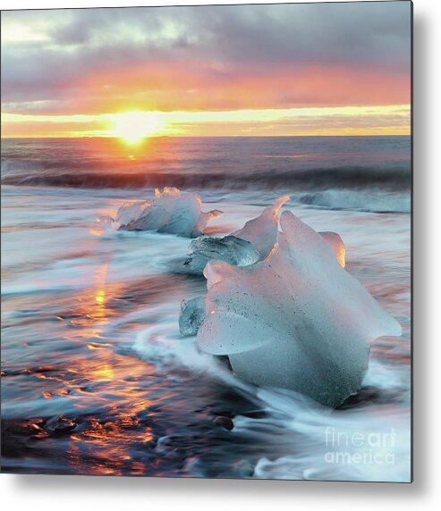 Beach Metal Print featuring the photograph Diamond beach, Iceland. Sunrise shot of chunks of ice on the black sand, that have been deposited on the beach from the Jokulsarlon glacier lagoon. by Jane Rix