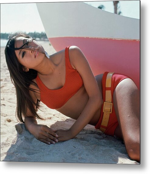 Beauty Metal Print featuring the photograph Model Reclines On The Beach In Hawaii by John Rawlings