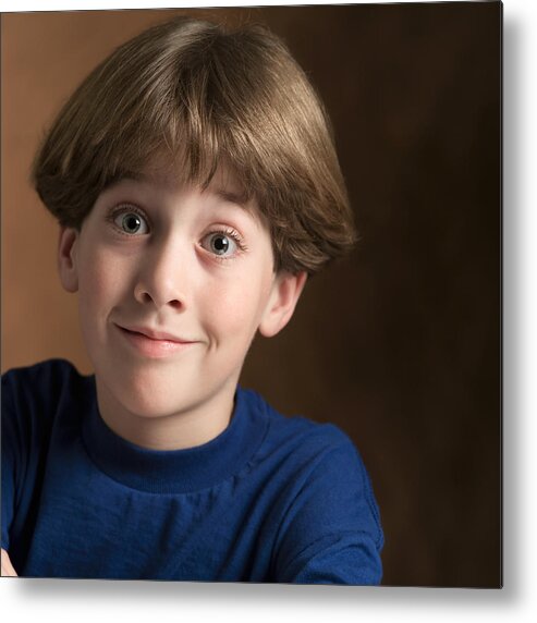 Child Metal Print featuring the photograph Portrait Of A Young Caucasian Boy In A Blue Shirt As He Flashes A Silly Grin by Photodisc