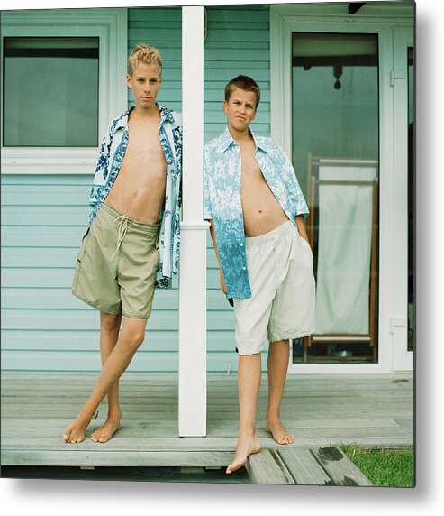 Cool Attitude Metal Print featuring the photograph Two teenage boys standing in front of house by Patrick Sheandell O'Carroll