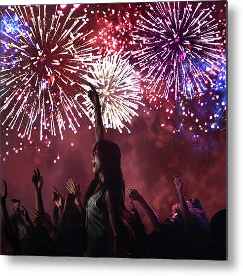 Fun Metal Print featuring the photograph Woman amongst crowd enjoying firework display by Flashpop