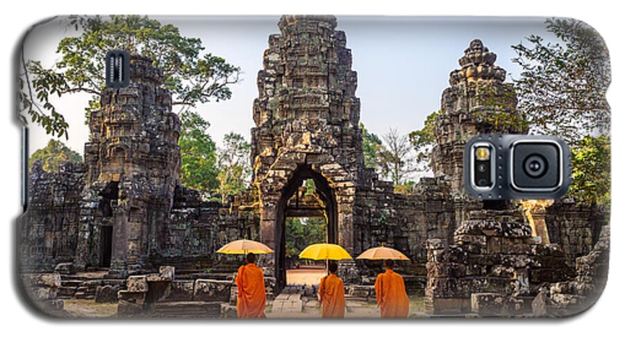 Angkor Galaxy S5 Case featuring the photograph Monks with umbrella walking into Angkor Wat temple - Cambodia #1 by Matteo Colombo