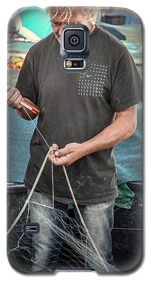Anzio Galaxy S5 Case featuring the photograph fisherman mending nets on Anzio harbour by Peter Noyce