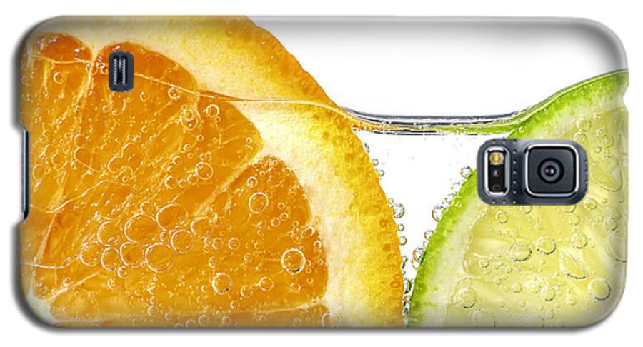 Orange Galaxy S5 Case featuring the photograph Orange and lime slices in water by Elena Elisseeva