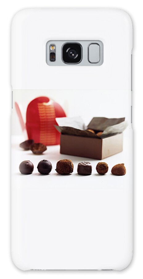 A Still Life Photo Of Gourmet Chocolates Galaxy Case