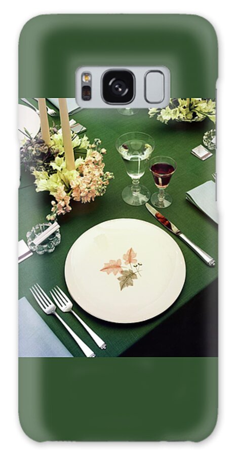 A Table Setting On A Green Tablecloth Galaxy Case