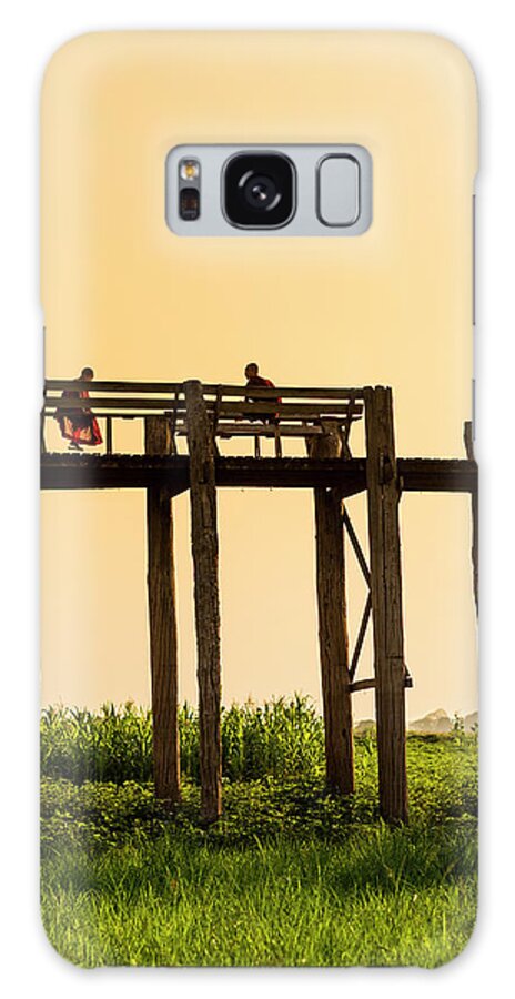 Grass Galaxy Case featuring the photograph Buddhist Monks Seated On U Bein Bridge by Merten Snijders