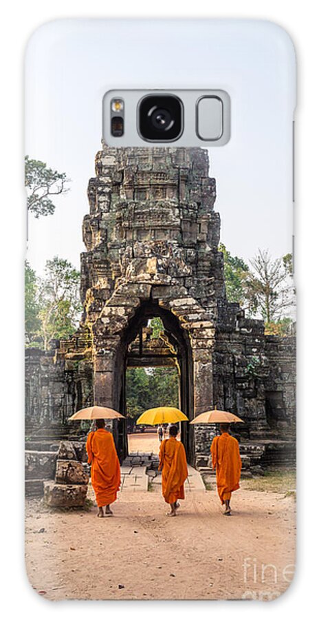 Angkor Galaxy Case featuring the photograph Monks with umbrella walking into Angkor Wat temple - Cambodia by Matteo Colombo