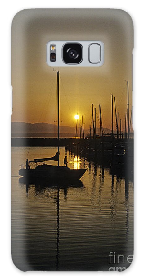 Landscape Galaxy S8 Case featuring the photograph Silhouetted man on Sailboat by Jim Corwin
