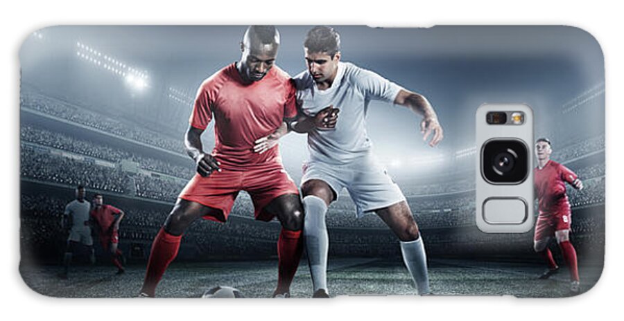 Soccer Uniform Galaxy Case featuring the photograph Soccer Player Kicking Ball In Stadium by Dmytro Aksonov