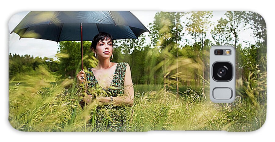 20-24 Years Galaxy Case featuring the photograph Woman Holding Umbrella In Field by Monica Donovan